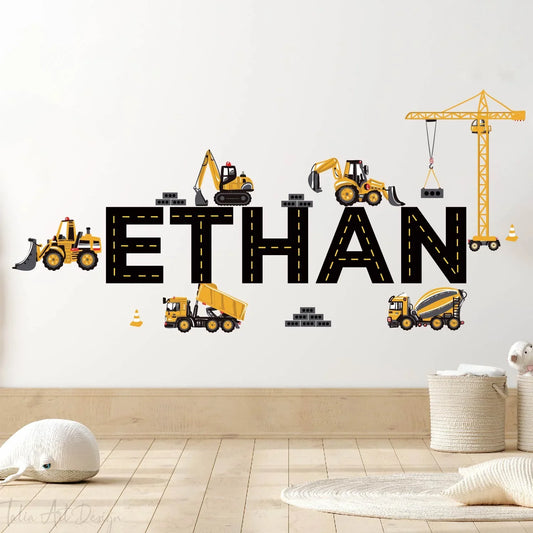 Custom kids room wall decal with name Ethan in road letters, decorated with construction vehicles and crane, on a nursery wall.