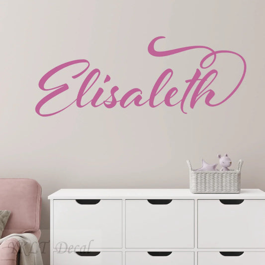 Personalized pink name wall decal 'Elisabeth' in kids room above white dresser, nursery decor