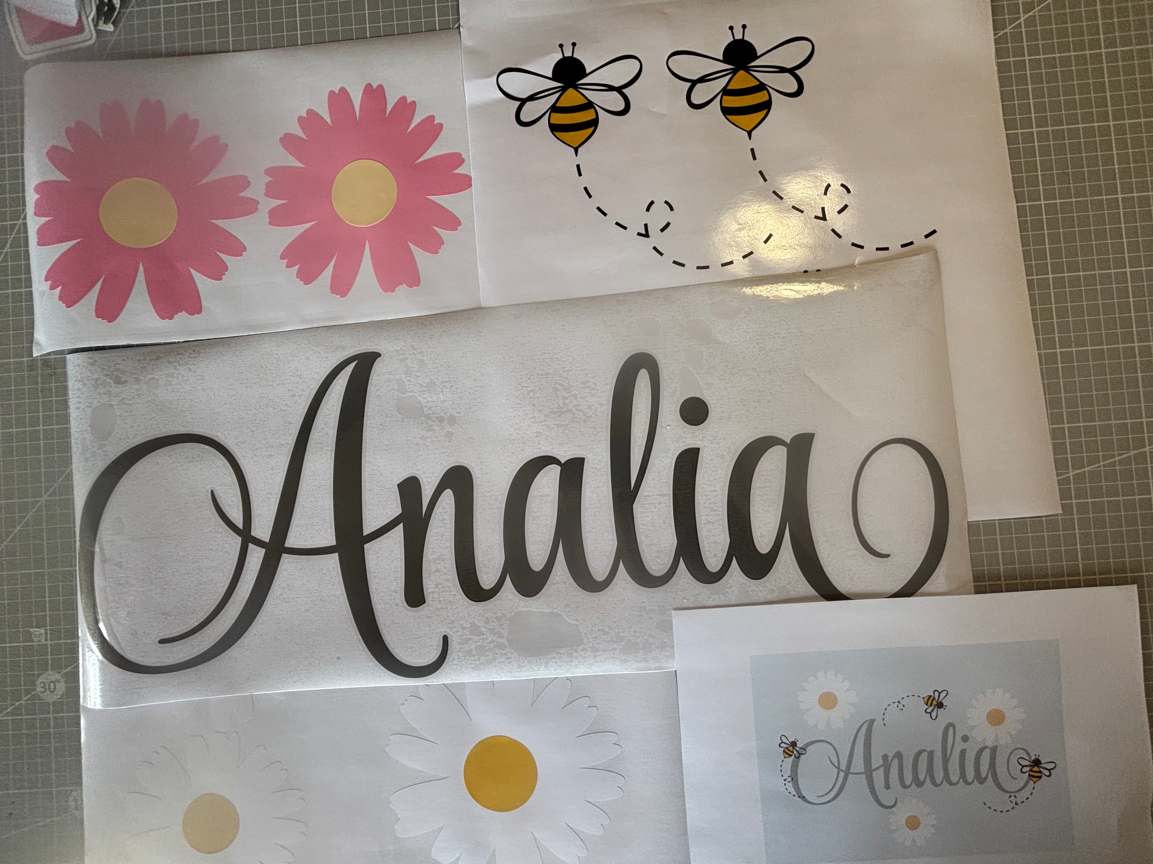 Hand applying custom daisy wall decal showcasing handcrafted and easy peel and stick YKLT Decals quality
