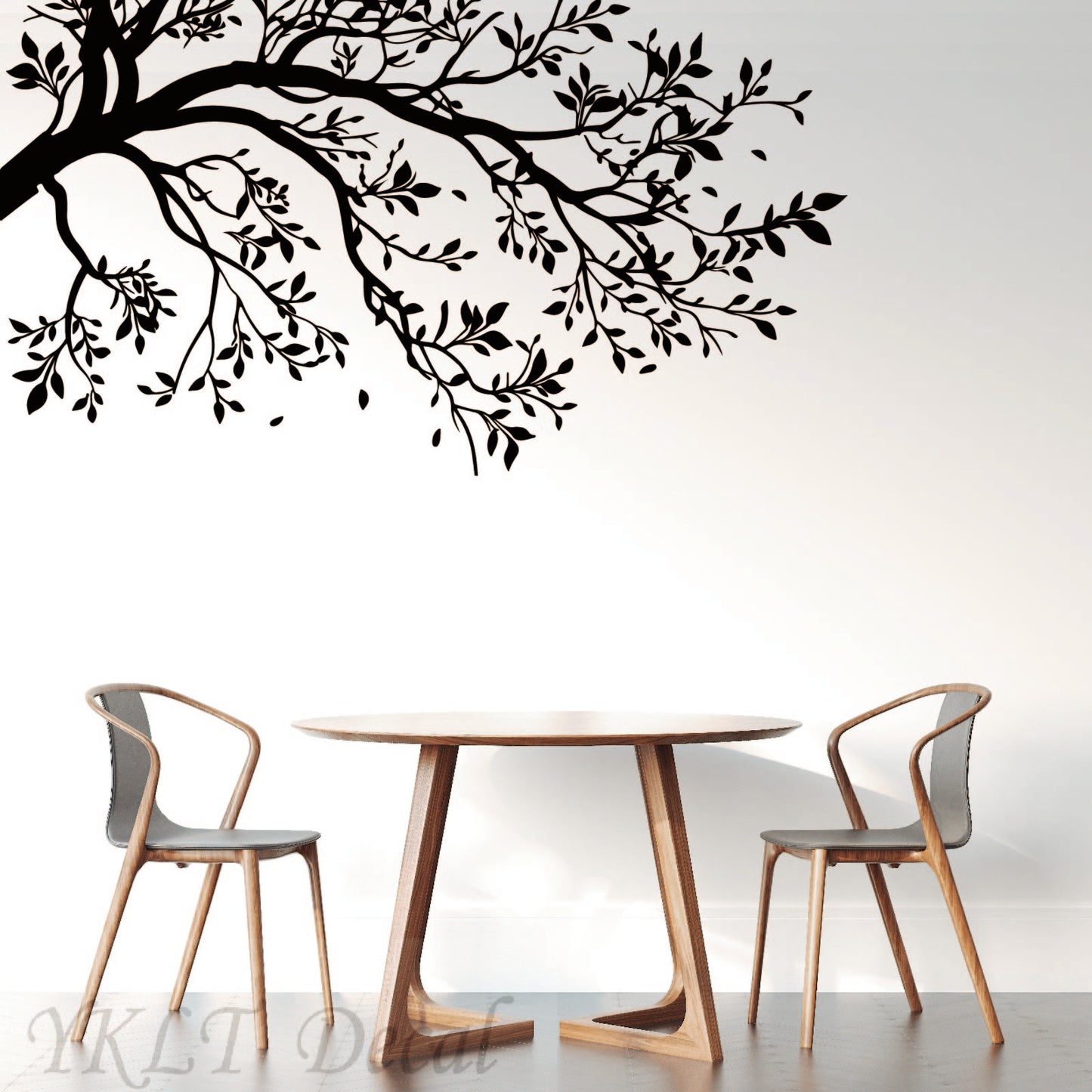 Tree vinyl sticker applied on wall showing elegant branch design for home decor

