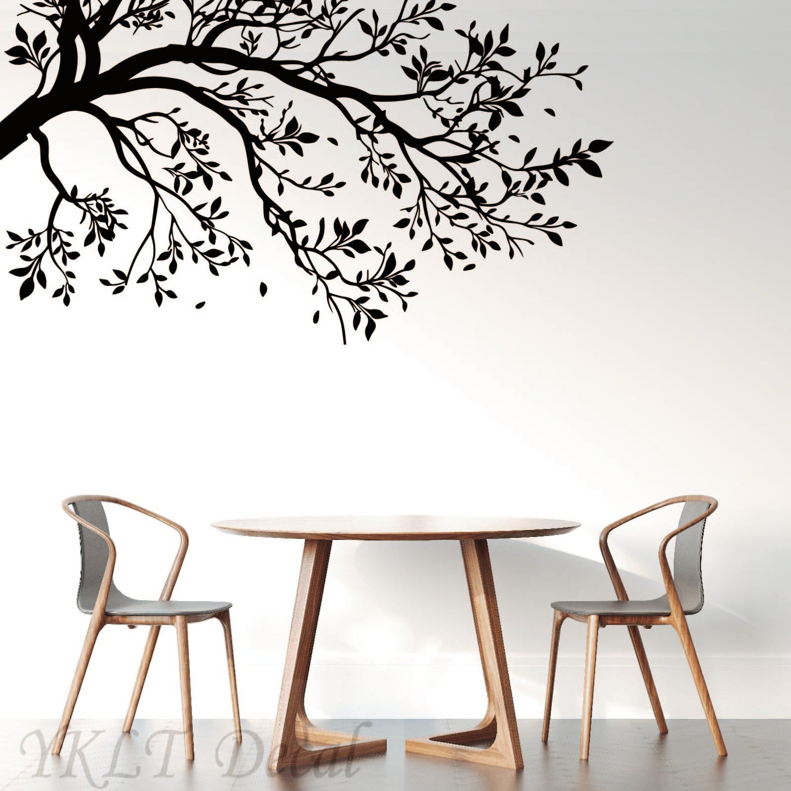 Tree vinyl sticker applied on wall showing elegant branch design for home decor
