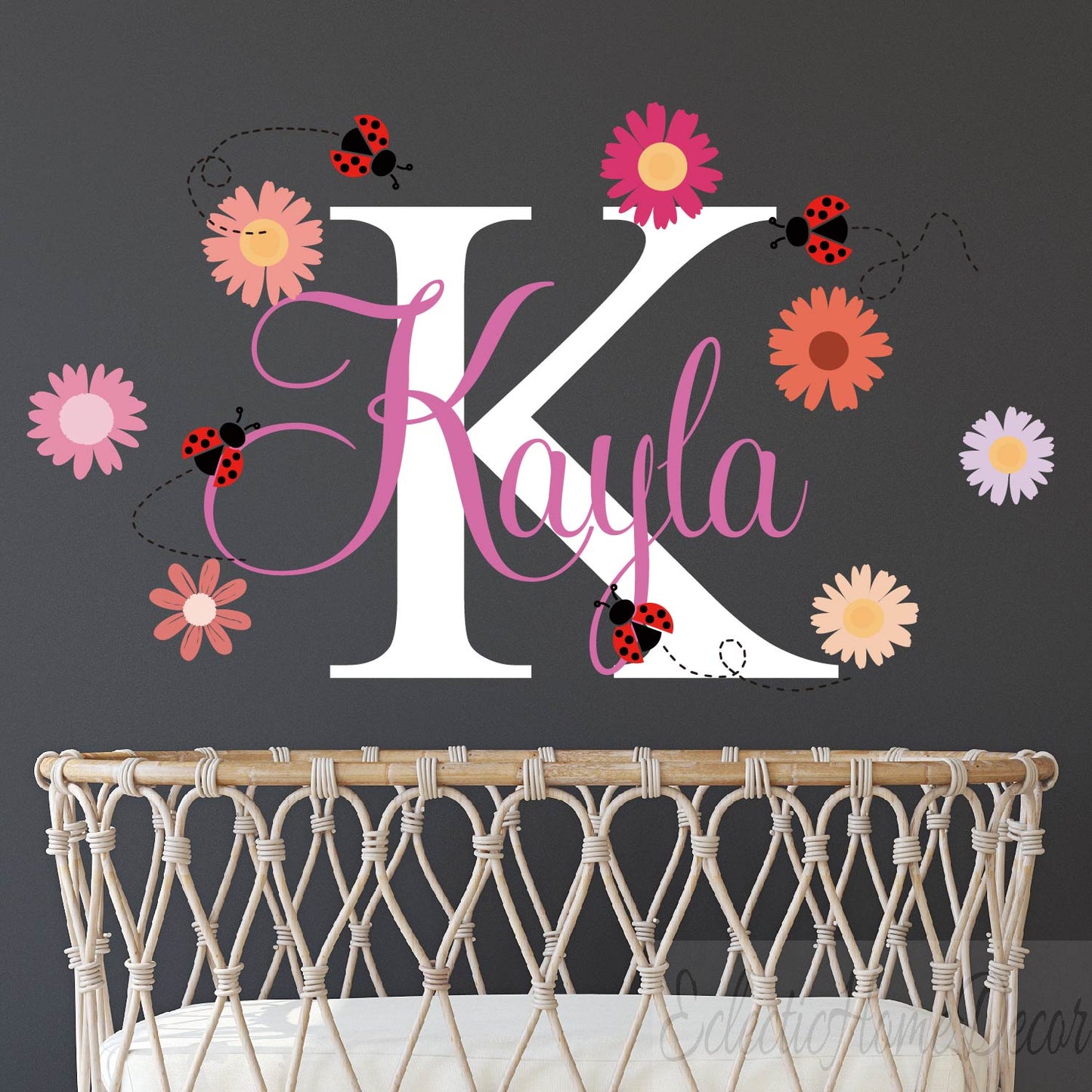 Custom name wall sticker featuring pink daisy flowers and cute ladybugs
