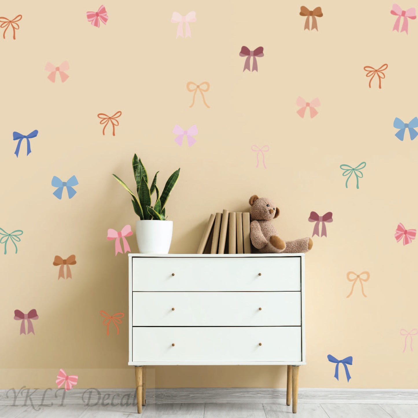 Peel and stick bow stickers in soft watercolor shades for girls room decor
