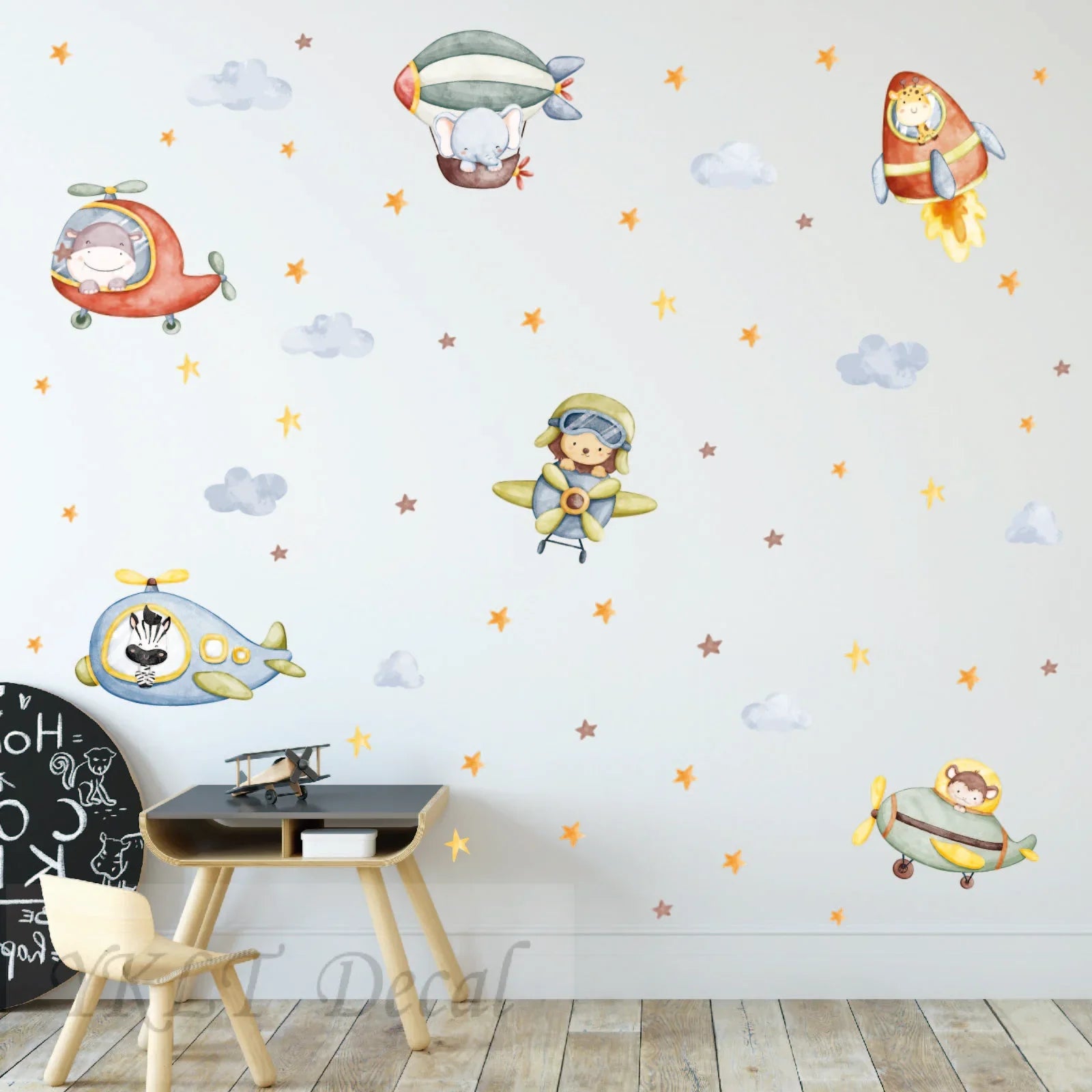 Kids room with YKLT Decals animal pilots wall decals, stars, clouds, and a small desk