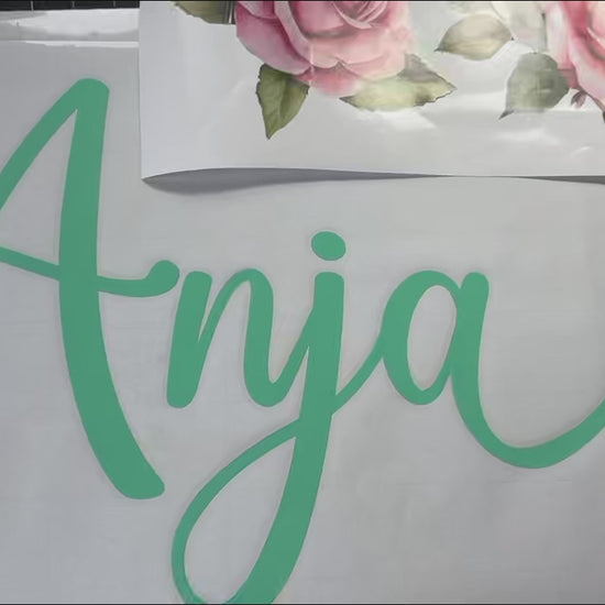 Custom pink flower wall decal installation and application video
